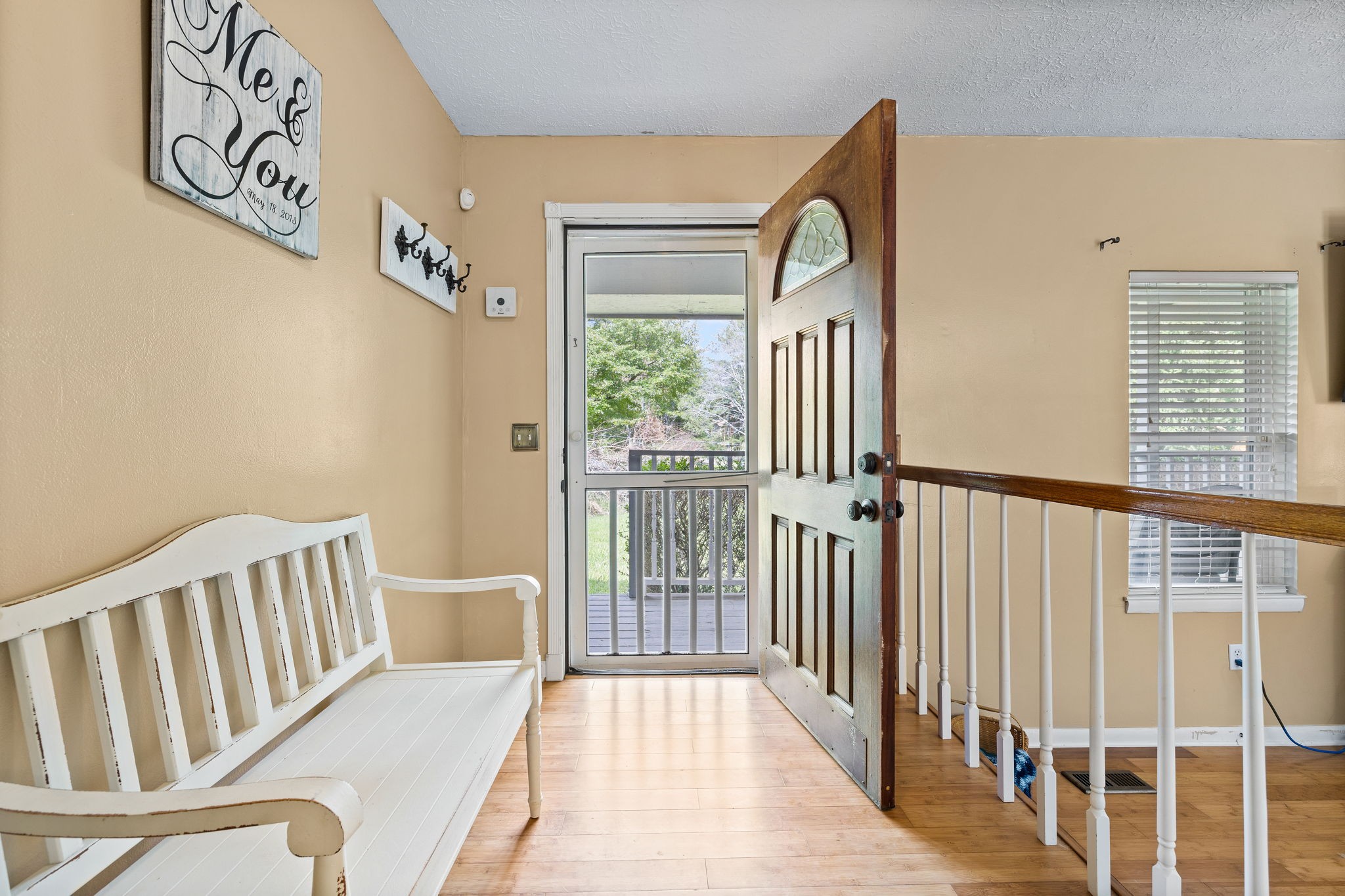 1165 Manley Loop Dickson, TN 37055 - Photo 5 of 29 a view of a hallway with wooden floor and windows
