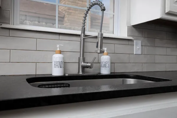 a kitchen with a sink and cabinets