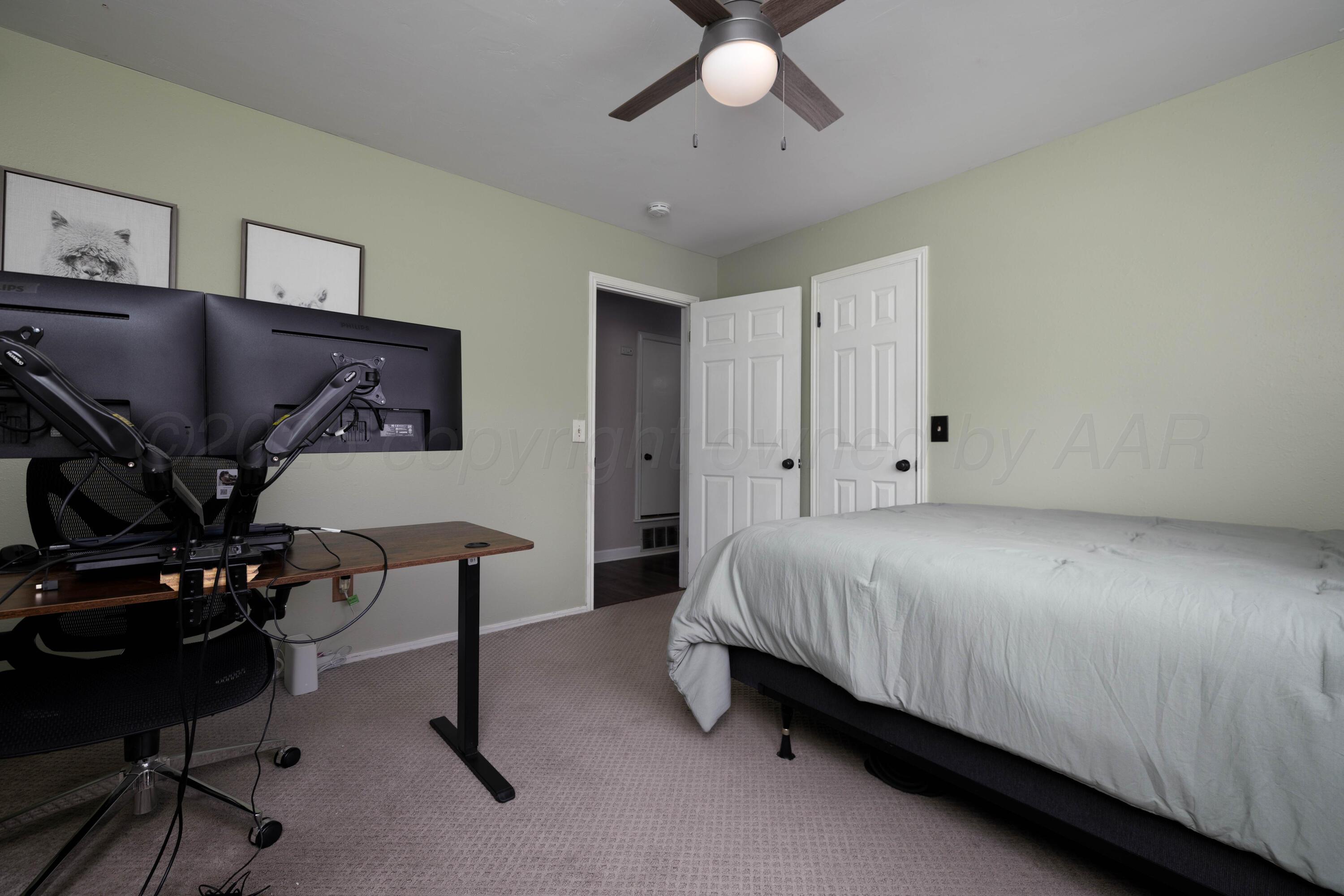 3509 Timber Drive Amarillo, TX 79121 - Photo 19 of 35 a bed room with a bed window and a chair