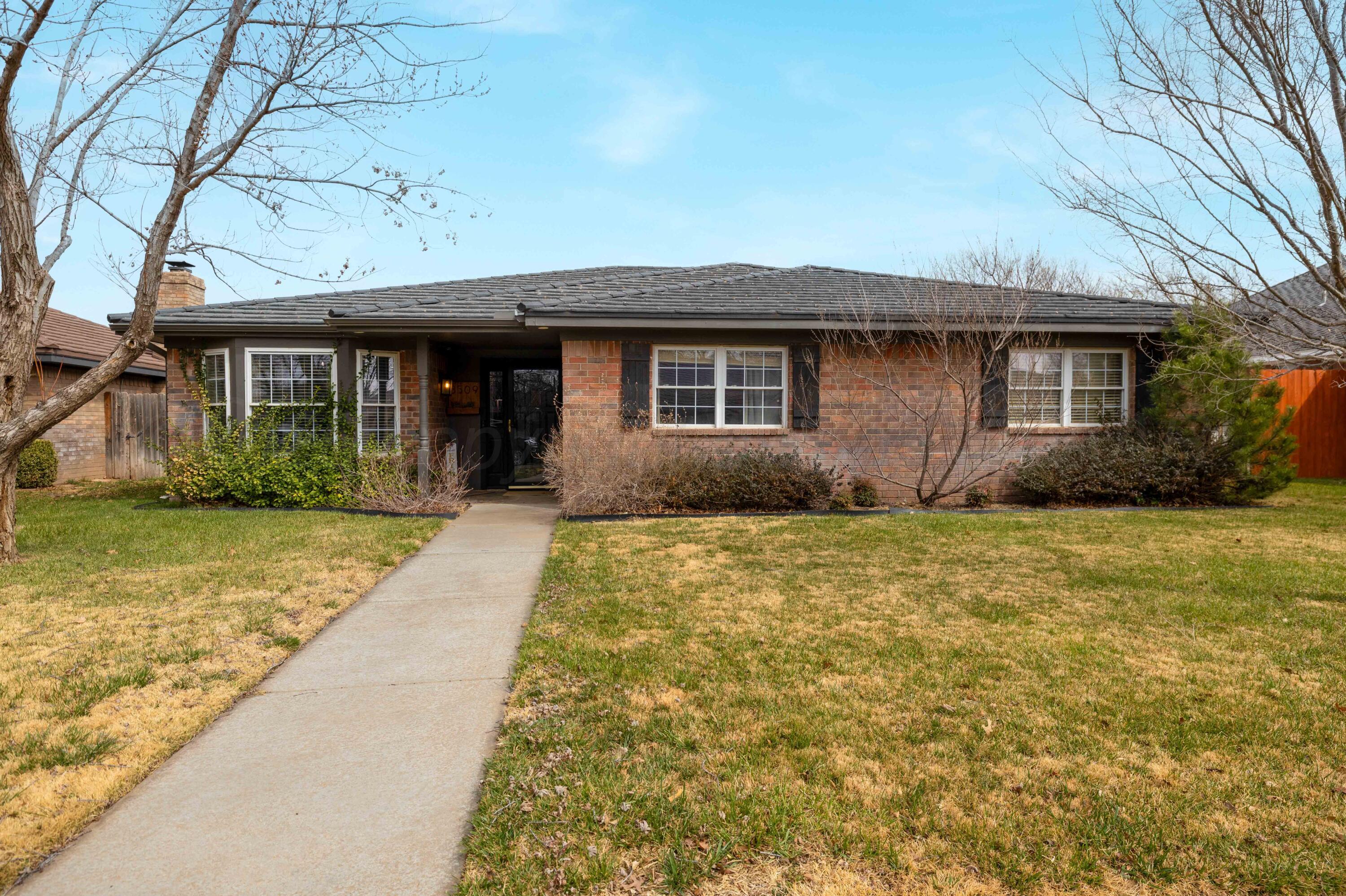 3509 Timber Drive Amarillo, TX 79121 - Photo 2 of 35 a front view of a house with garden