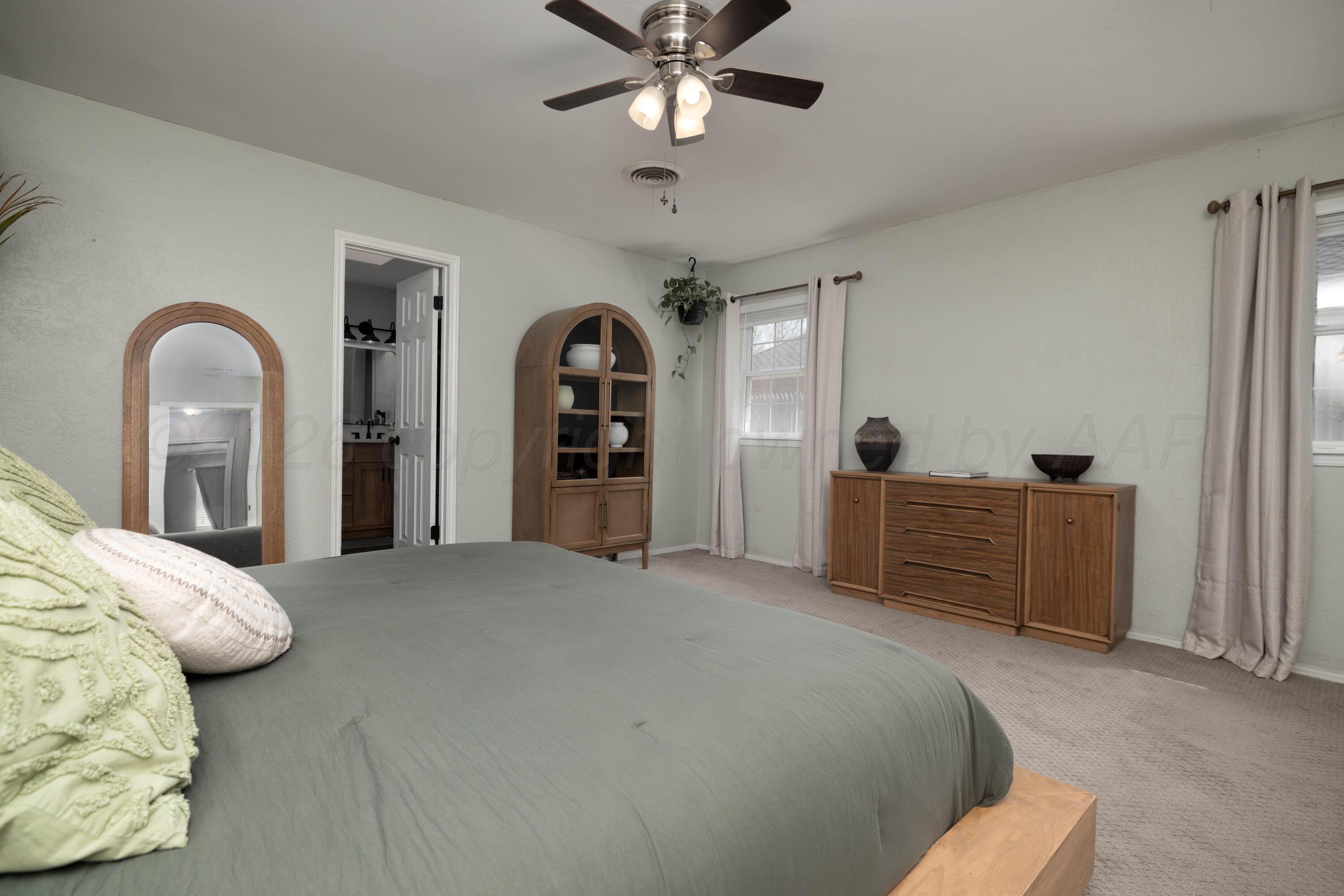 3509 Timber Drive Amarillo, TX 79121 - Photo 25 of 35 a bedroom with bed and ceiling fan