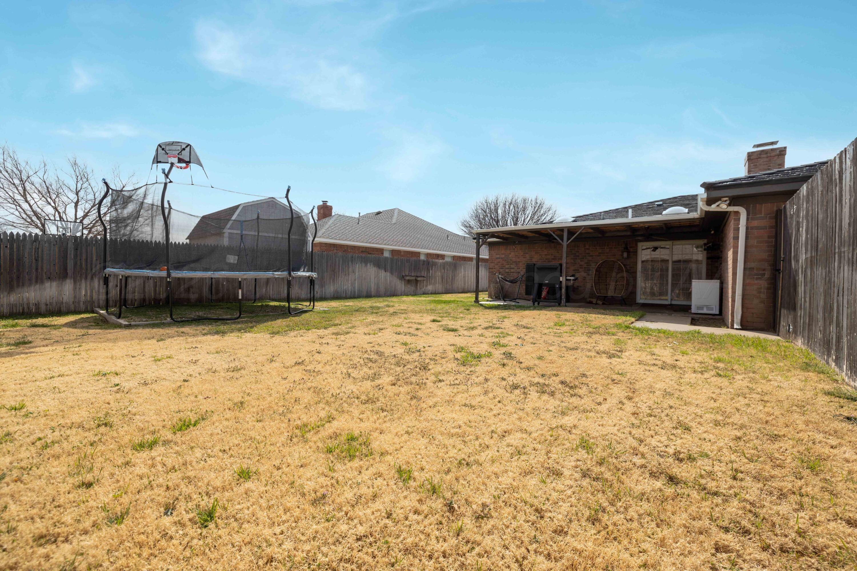3509 Timber Drive Amarillo, TX 79121 - Photo 33 of 35 a view of a backyard of a house