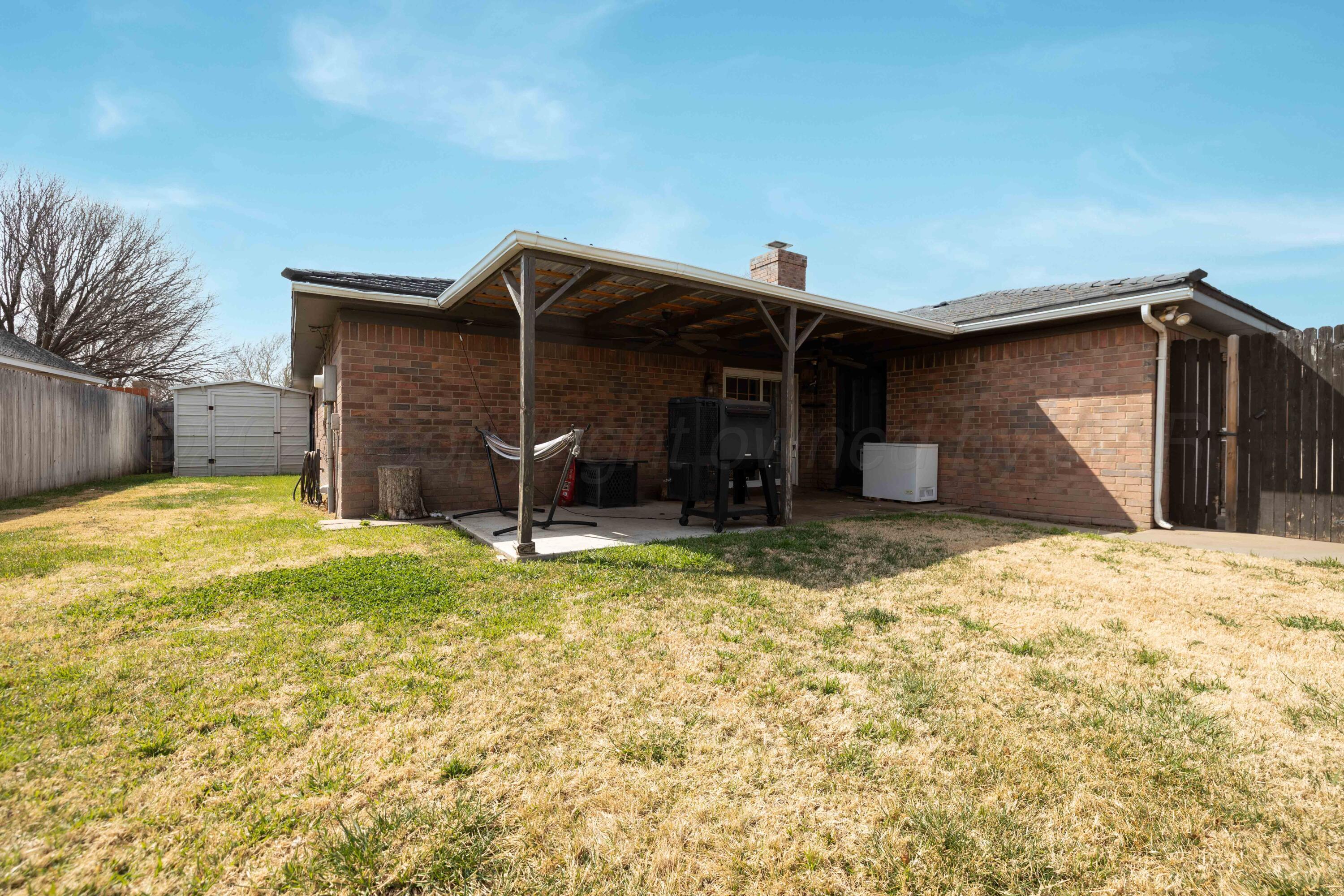 3509 Timber Drive Amarillo, TX 79121 - Photo 34 of 35 a view of a house with a yard and garage