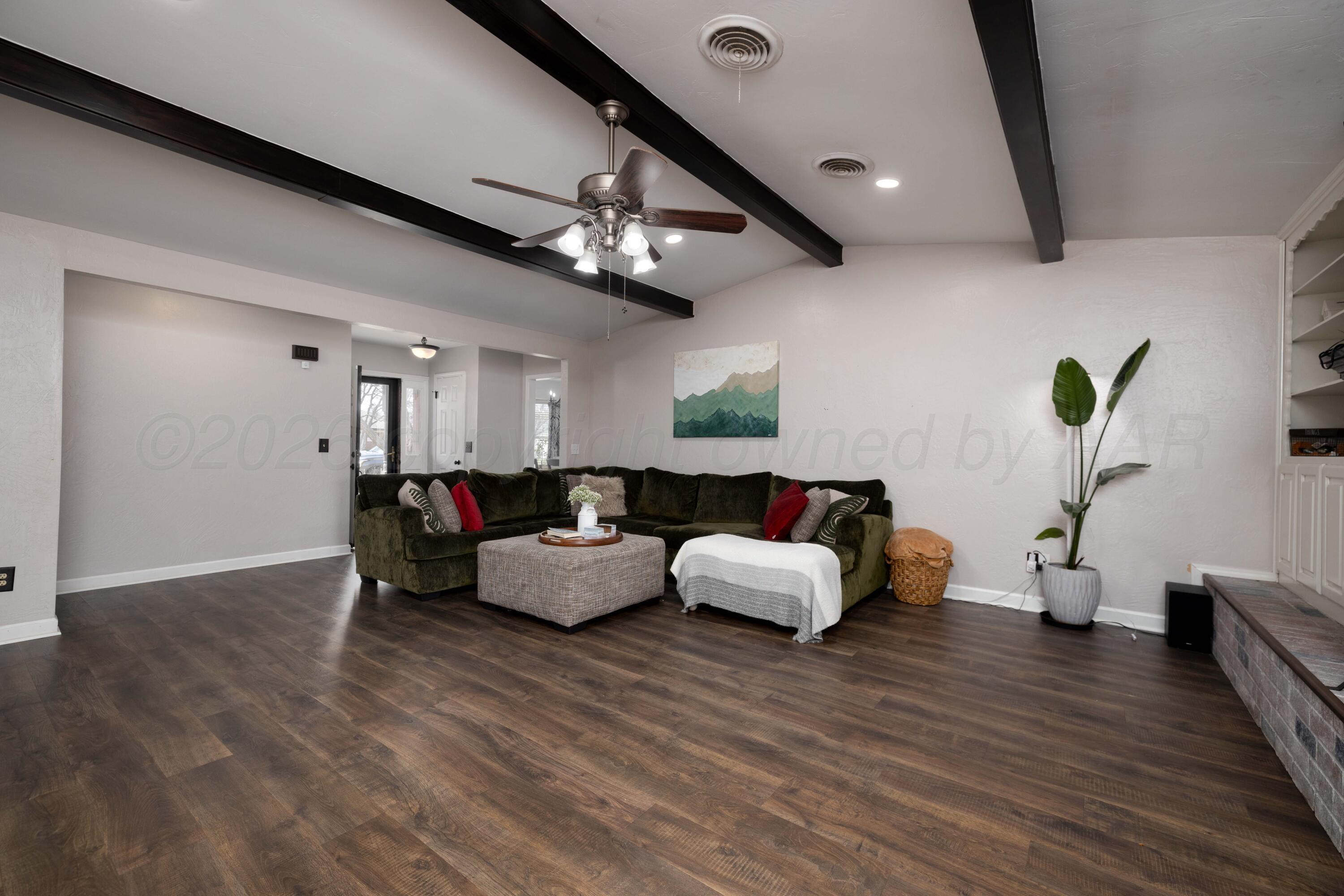 3509 Timber Drive Amarillo, TX 79121 - Photo 5 of 35 a living room with furniture and wooden floor