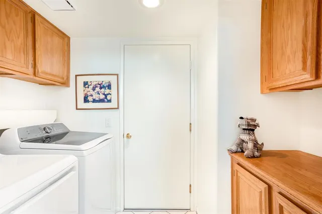 a room with a sink and cabinets