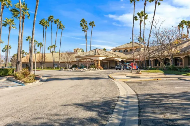 a swimming pool with outdoor seating and yard