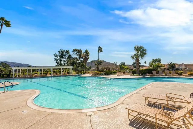 a view of a swimming pool with a lake view