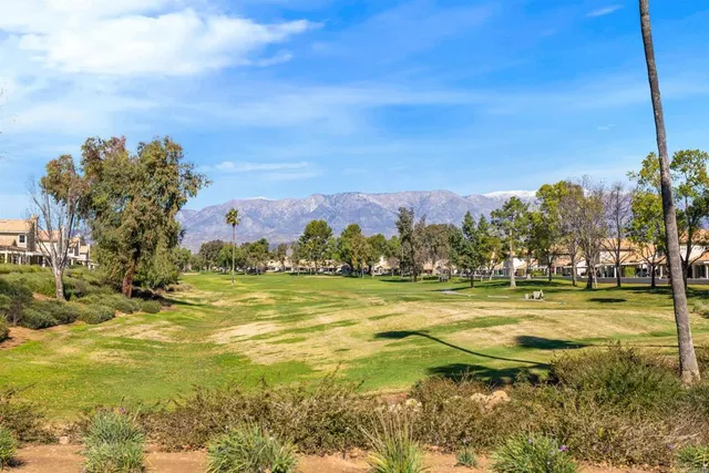 a view of a city street with a building in the background