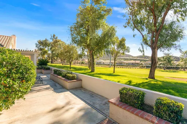 a view of swimming pool with sitting area