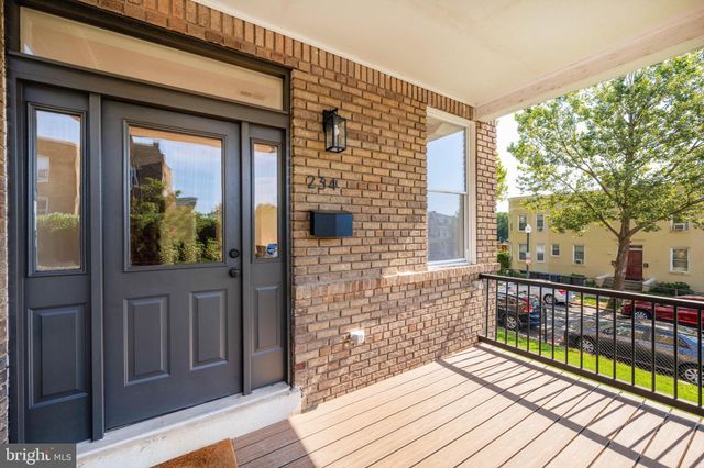 a view of a balcony with wooden floor