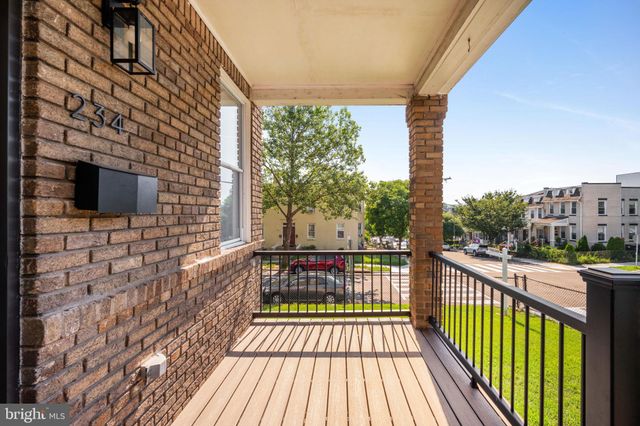 a view of balcony with wooden floor and city view