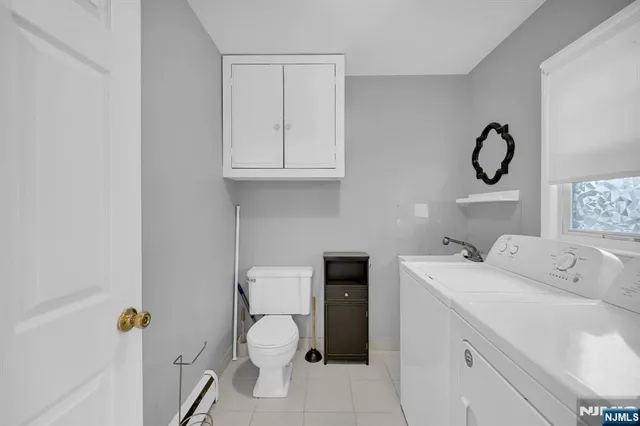 a bathroom with a sink toilet and vanity