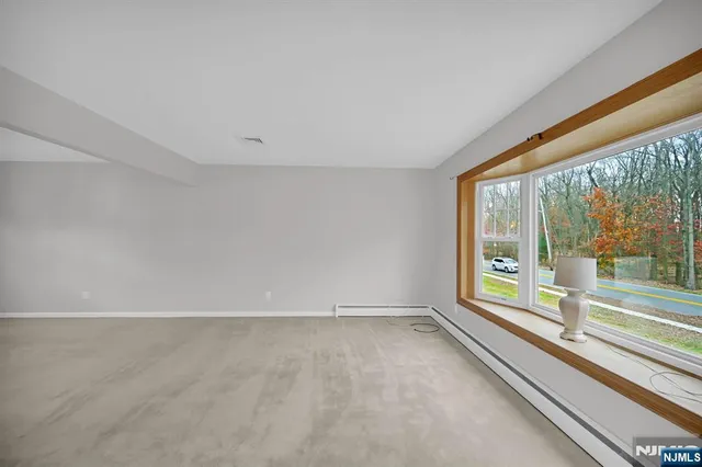 a view of an empty room with a large window