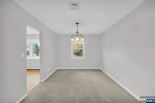 an empty room that has a window in it