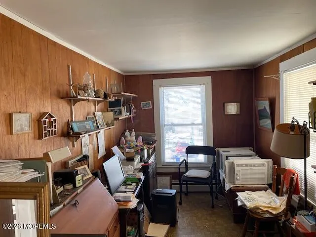 a work room with furniture and a window