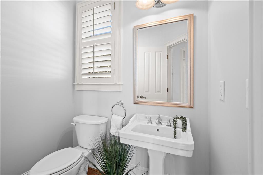932 Manor Parc Drive Decatur, GA 30033 - Photo 15 of 38 a bathroom with a sink a toilet and mirror