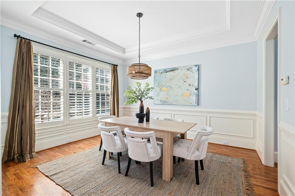 932 Manor Parc Drive Decatur, GA 30033 - Photo 2 of 38 a dining room with furniture a chandelier and wooden floor