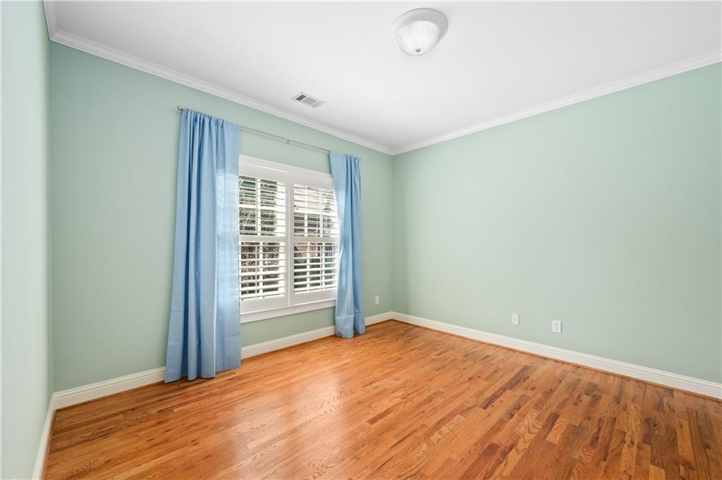 932 Manor Parc Drive Decatur, GA 30033 - Photo 26 of 38 a view of empty room with wooden floor and fan