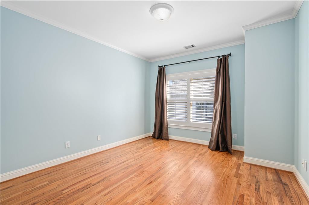932 Manor Parc Drive Decatur, GA 30033 - Photo 28 of 38 a view of an empty room with wooden floor and a window