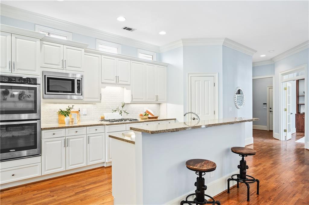 932 Manor Parc Drive Decatur, GA 30033 - Photo 7 of 38 a kitchen with granite countertop a sink appliances and cabinets