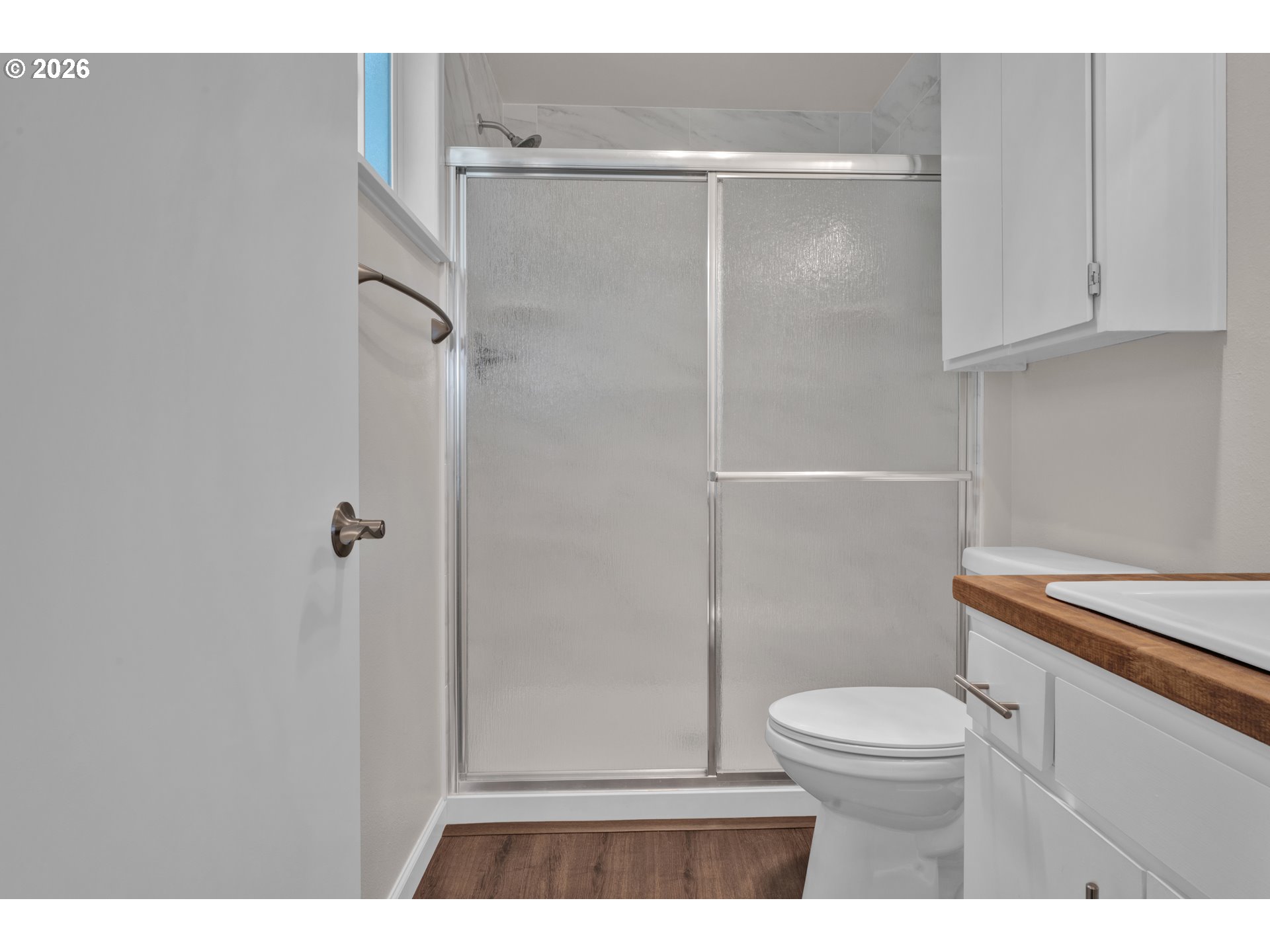 1142 9th Street Florence, OR 97439 - Photo 21 of 41 a bathroom with a toilet and a shower