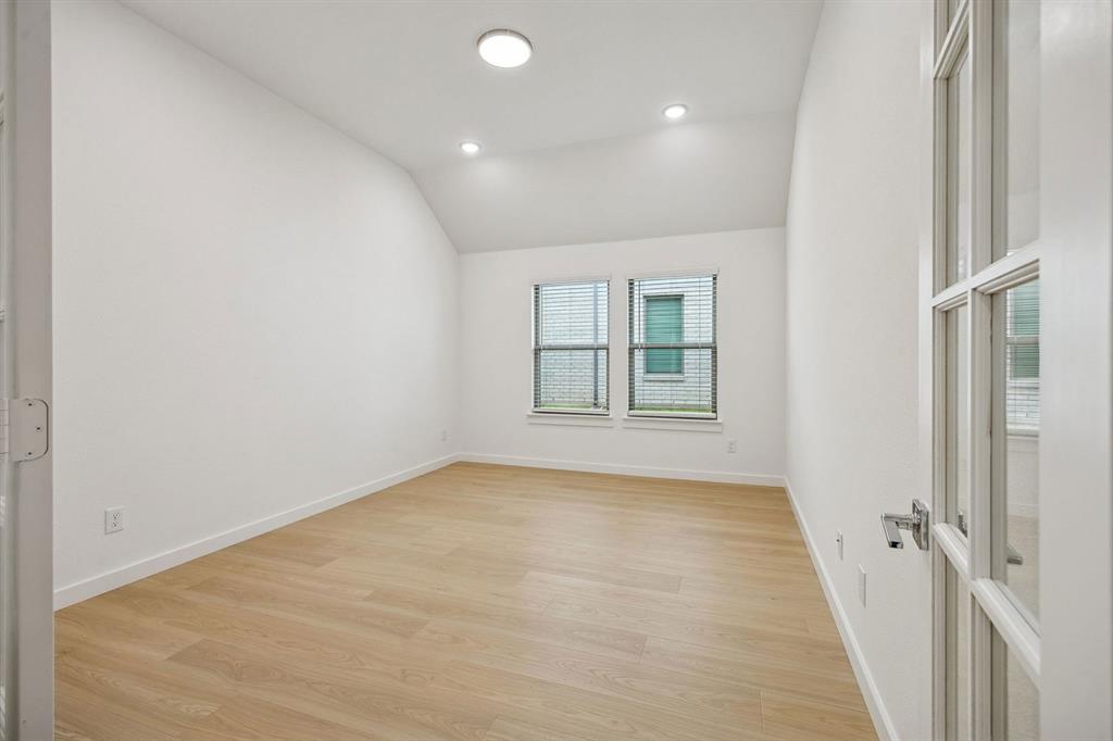 348 Yellowstar Lane Lavon, TX 75166 - Photo 15 of 39 an empty room with windows