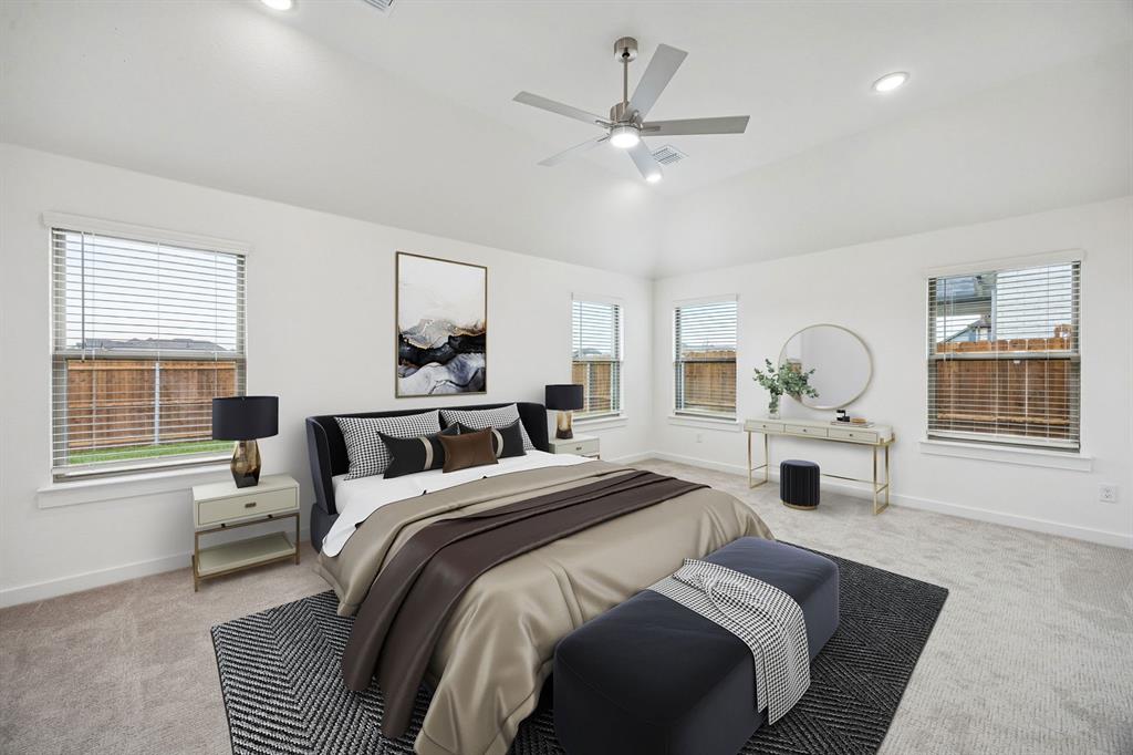 348 Yellowstar Lane Lavon, TX 75166 - Photo 16 of 39 a bedroom with a bed and a chandelier