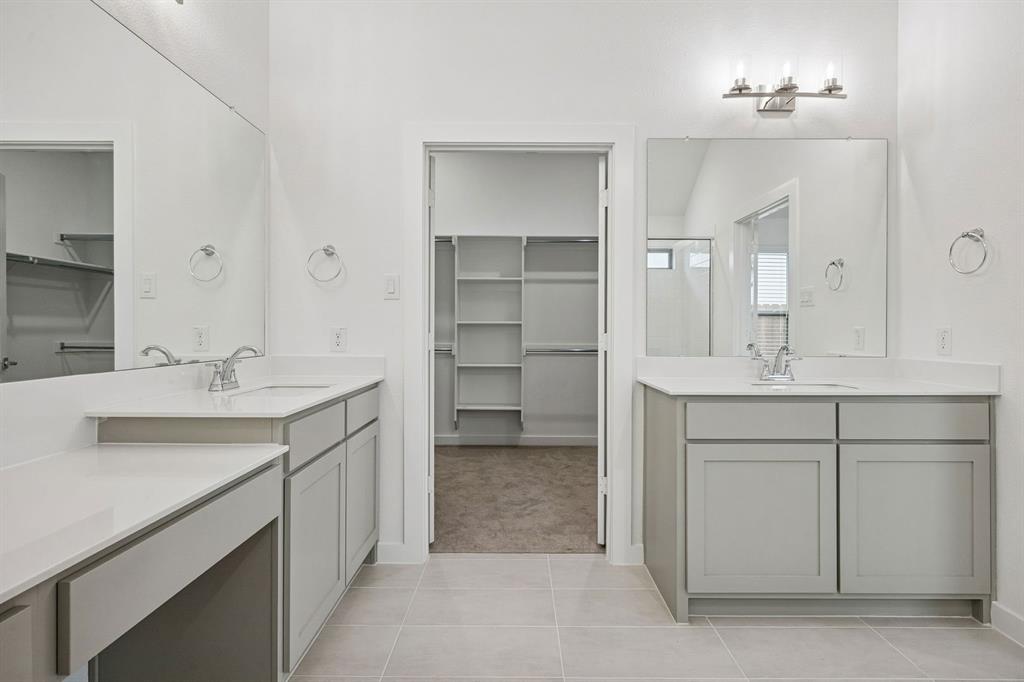 348 Yellowstar Lane Lavon, TX 75166 - Photo 20 of 39 a bathroom with a sink and a mirror