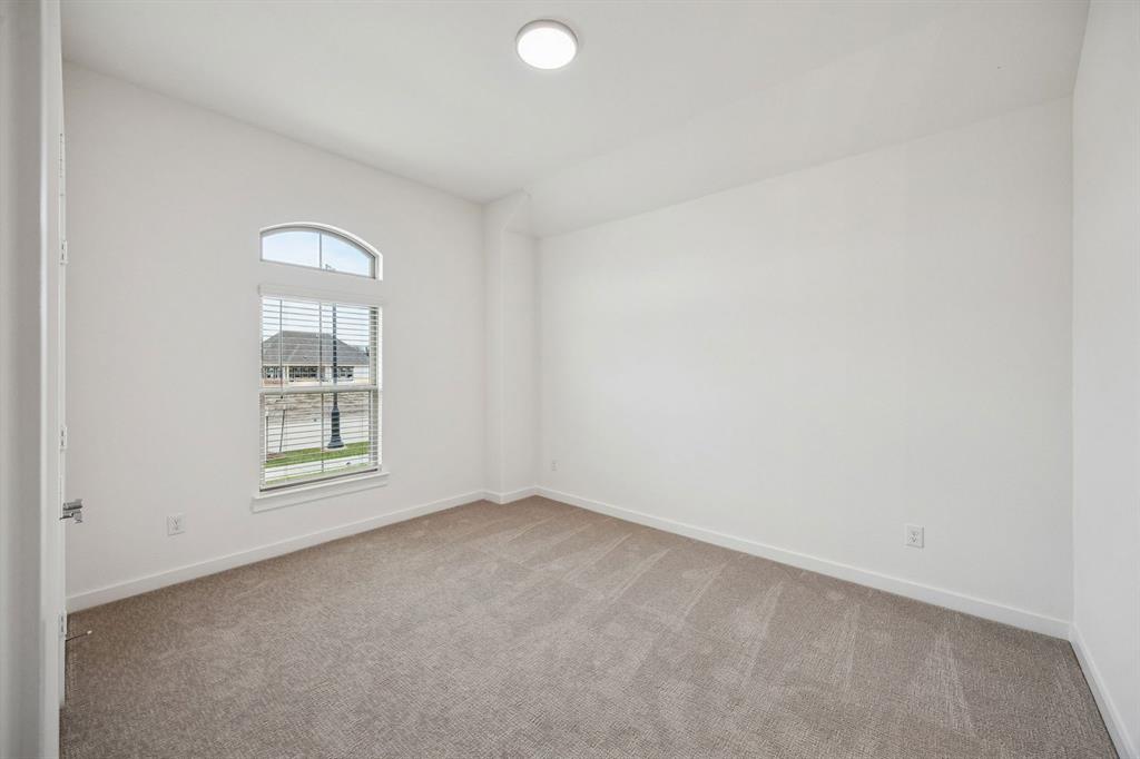 348 Yellowstar Lane Lavon, TX 75166 - Photo 23 of 39 an empty room with windows