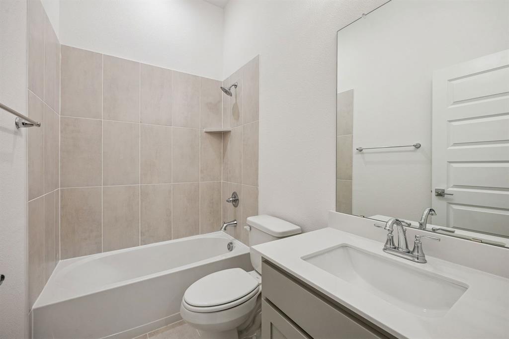 348 Yellowstar Lane Lavon, TX 75166 - Photo 28 of 39 a bathroom with a sink toilet and shower