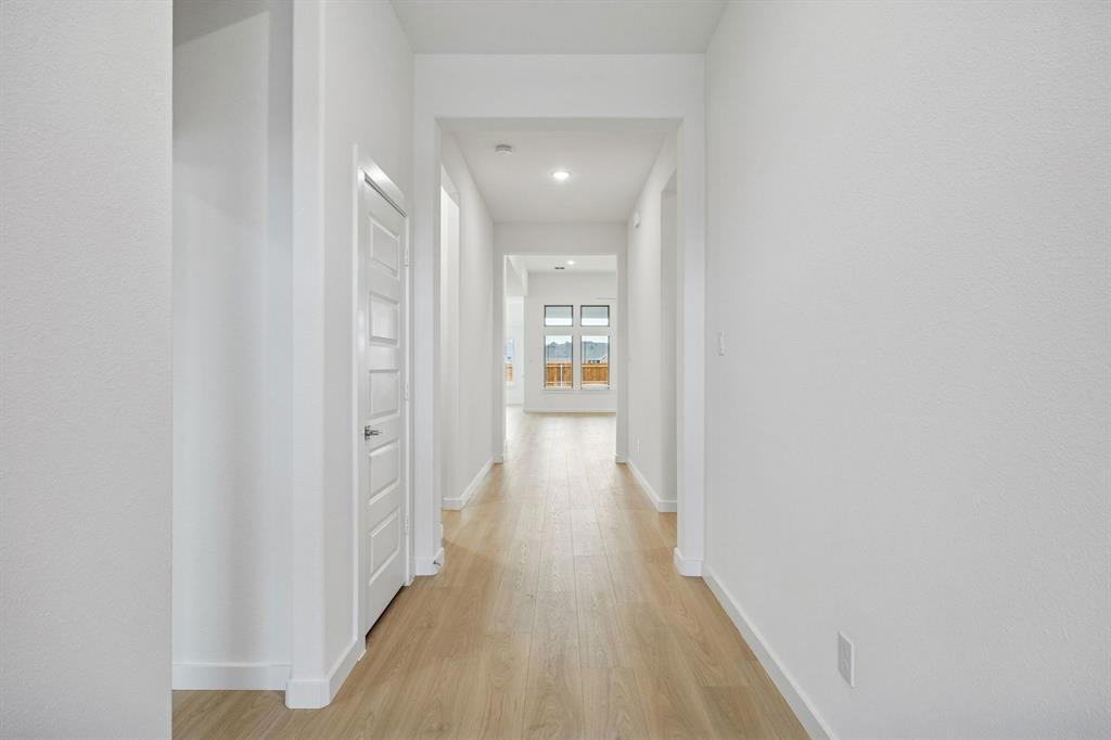 348 Yellowstar Lane Lavon, TX 75166 - Photo 31 of 39 a view of a hallway with wooden floor