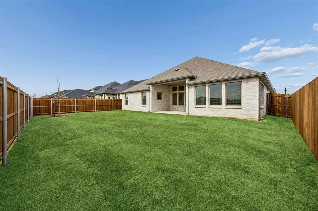 348 Yellowstar Lane Lavon, TX 75166 - Photo 35 of 39 a view of a house with backyard and garden