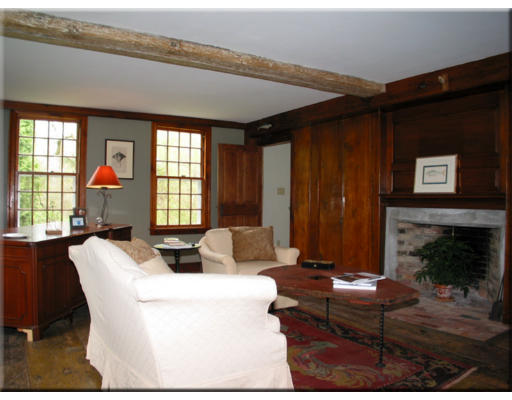 168 Argilla Road Ipswich, MA 01938 - Photo 16 of 27 a living room with furniture a fireplace and a large window