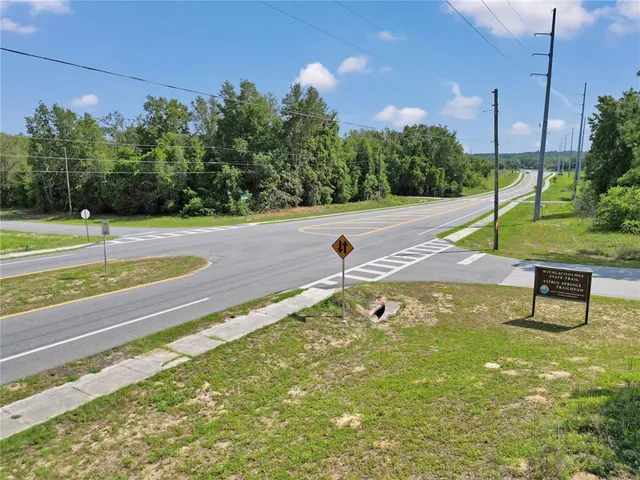 an open kitchen with white cabinets and stainless steel appliances
