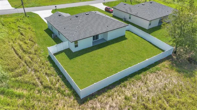 a view of a backyard with a garden and plants