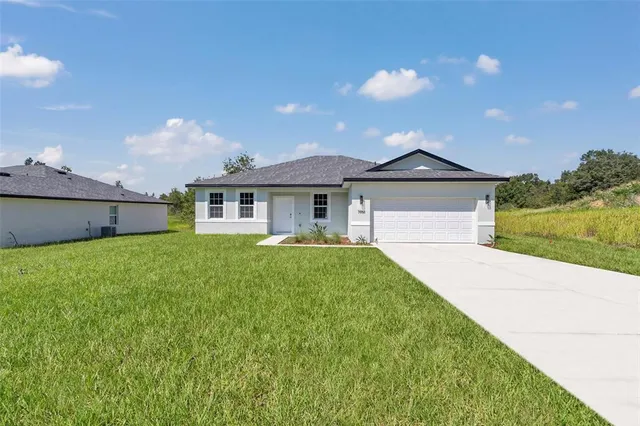 a house view with a backyard space