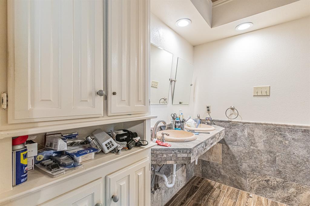 3309 Timber View Circle Bedford, TX 76021 - Photo 16 of 38 a view of a sink and cabinets