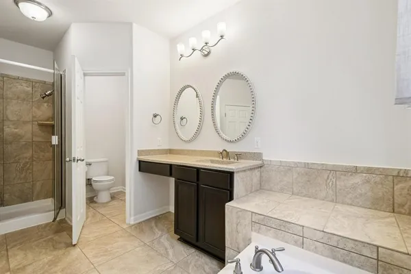 a view of bathroom with dual sinks