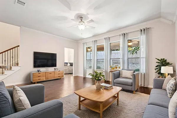 a living room with furniture and a flat screen tv