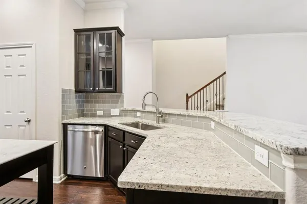 a view of a sink and cabinets