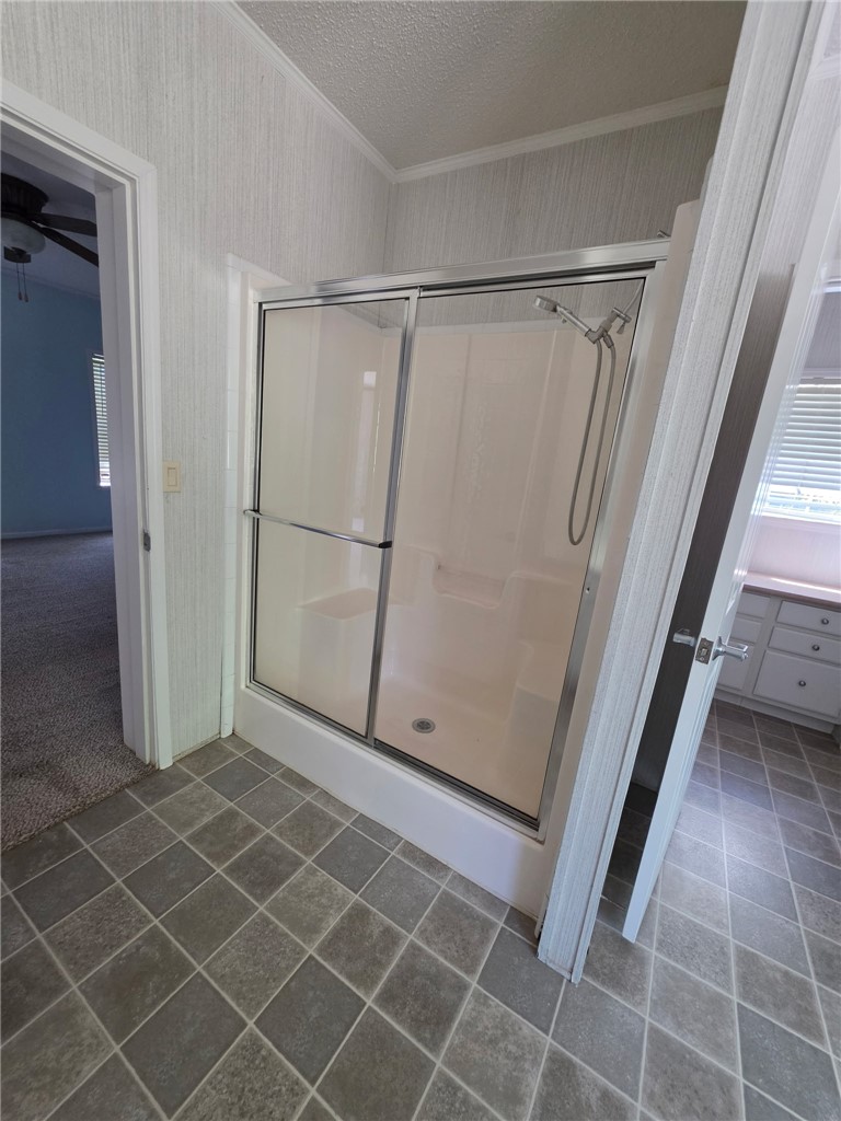 1400 Massey Road Pendleton, SC 29670 - Photo 17 of 25 This bathroom features a shower enclosure and tile flooring, ready for comfortable living.