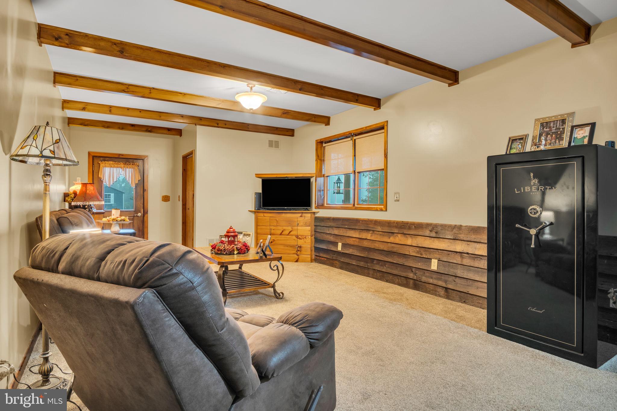 1105 Ridge Road Halifax, PA 17032 - Photo 16 of 61 a living room with furniture and a chandelier