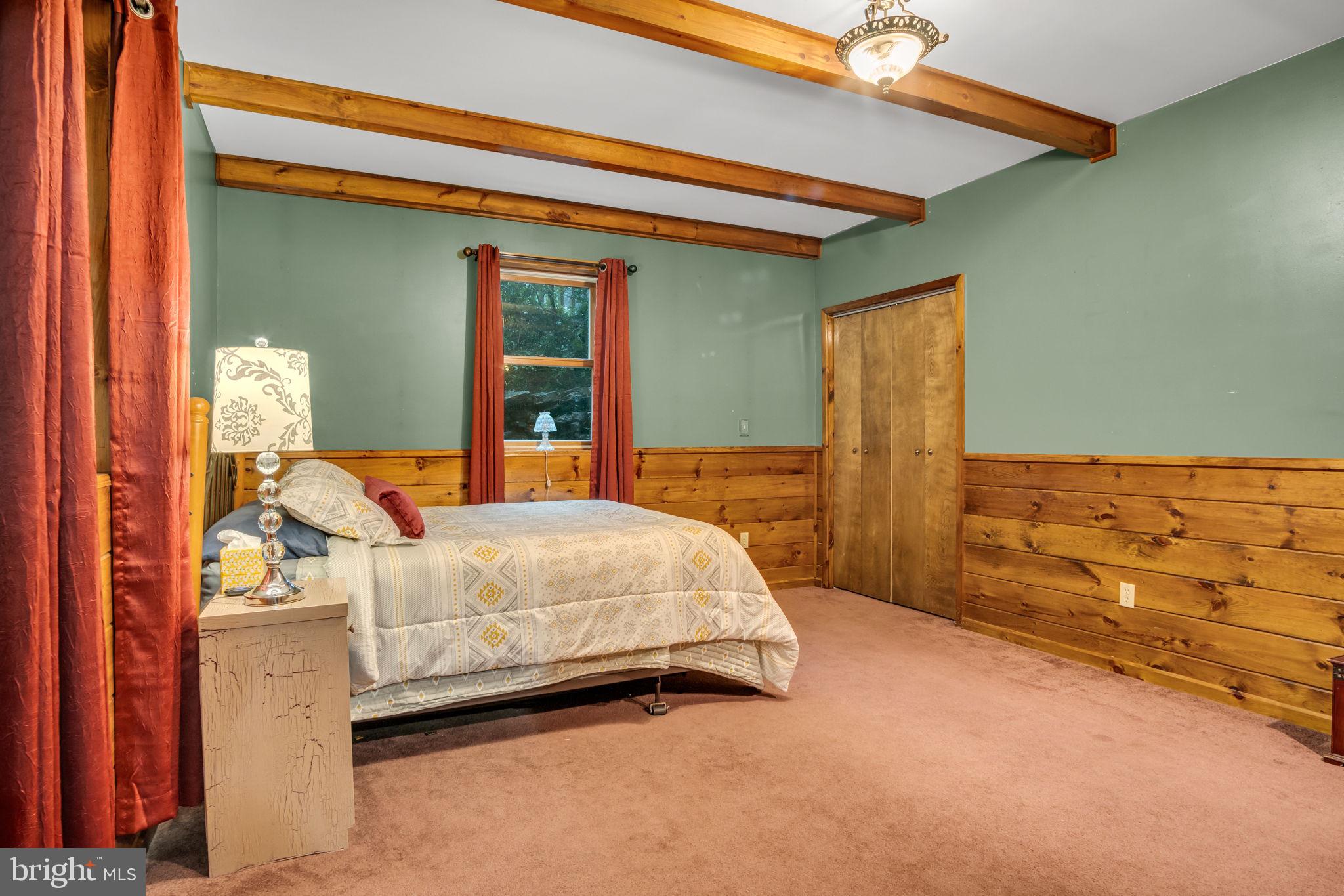 1105 Ridge Road Halifax, PA 17032 - Photo 20 of 61 a bed room with a bed and a chair