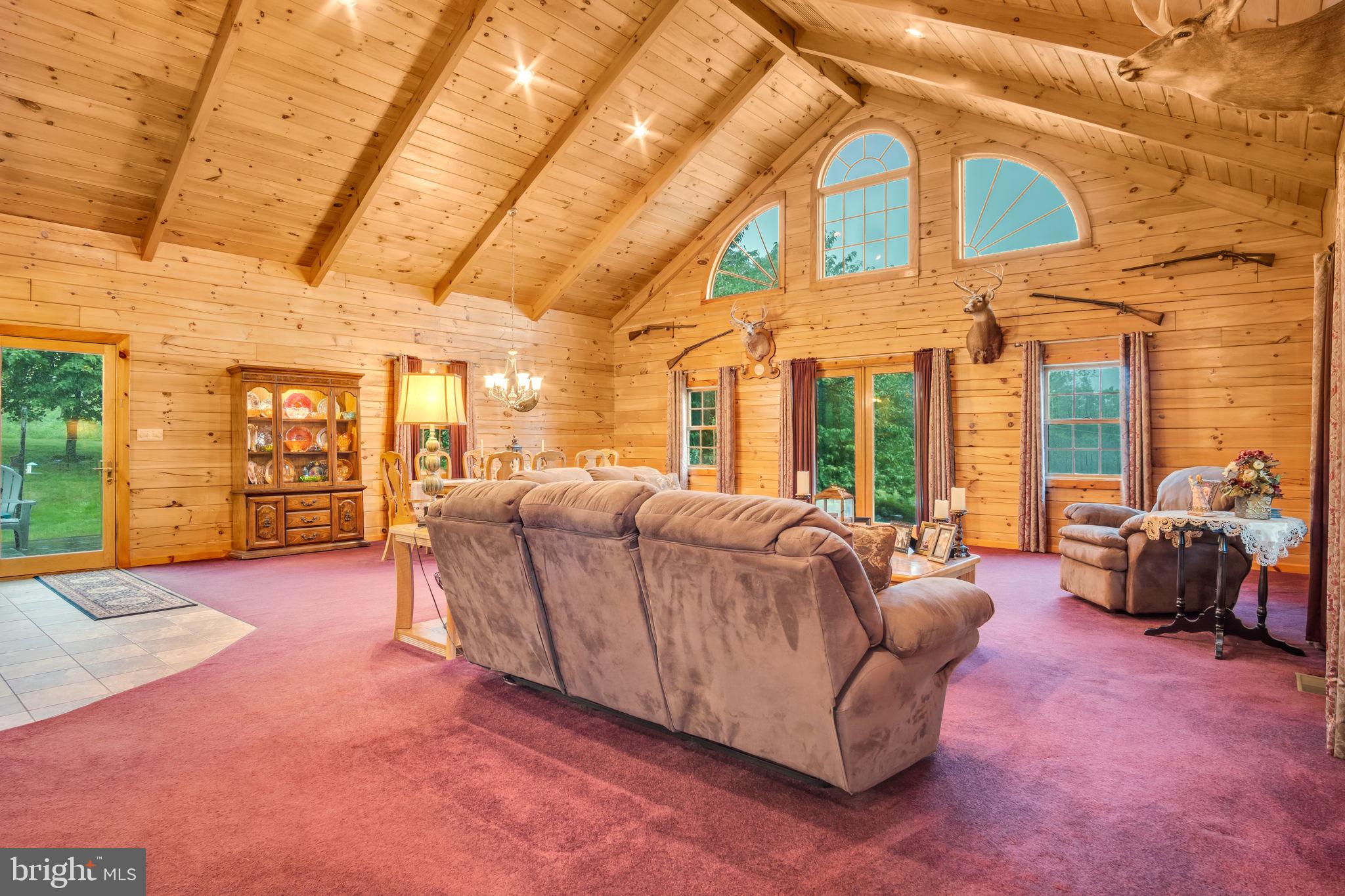 1105 Ridge Road Halifax, PA 17032 - Photo 23 of 61 a living room with furniture and large windows