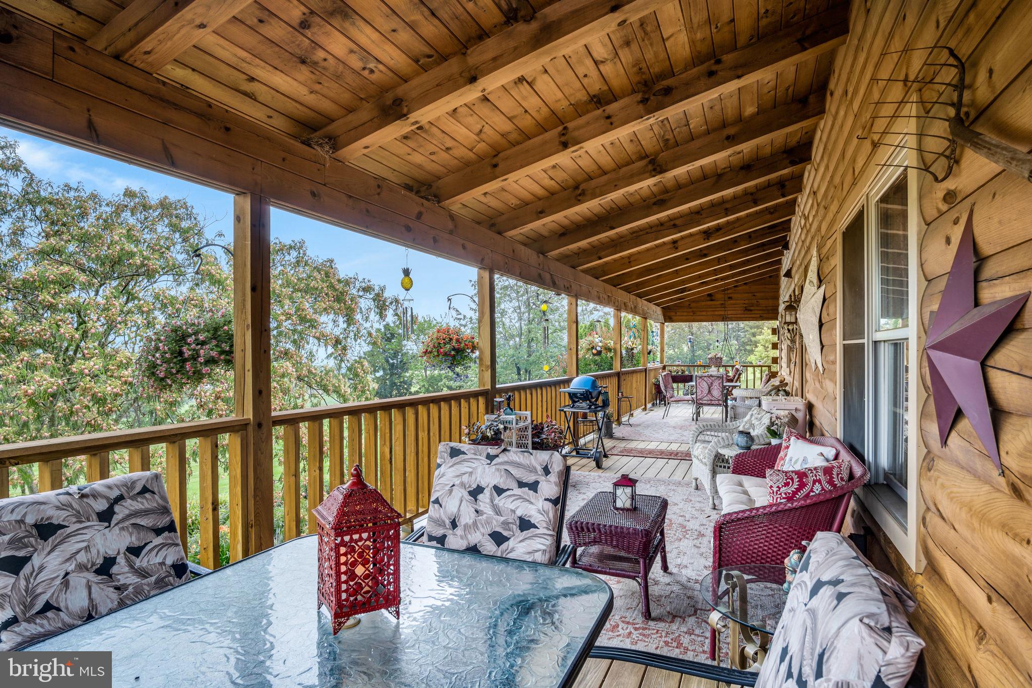 1105 Ridge Road Halifax, PA 17032 - Photo 43 of 61 a view of a patio with couches chairs with wooden floor