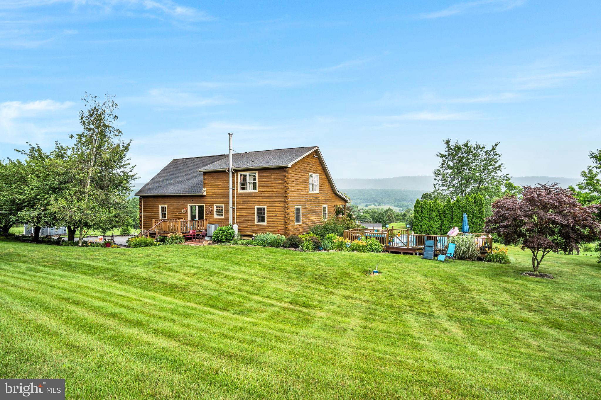 1105 Ridge Road Halifax, PA 17032 - Photo 49 of 61 a front view of a house with a yard and garage