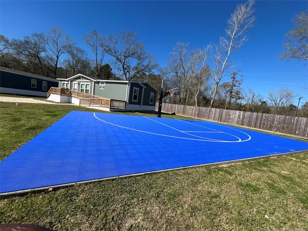 a view of a pool with a backyard