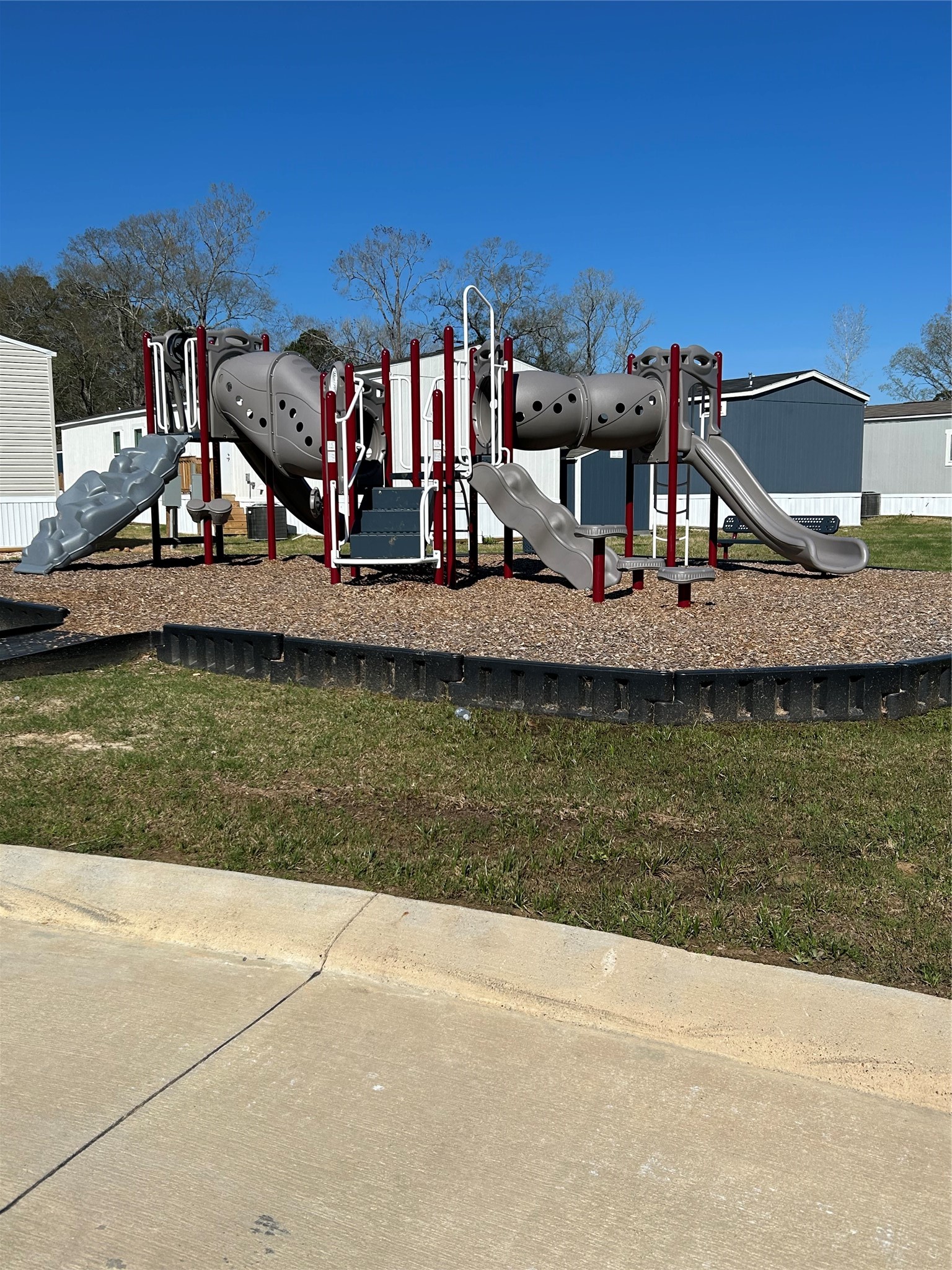 19130 Fm 1485 Road, Unit 153 New Caney, TX 77357 - Photo 3 of 9 a front view of a house with a ocean view