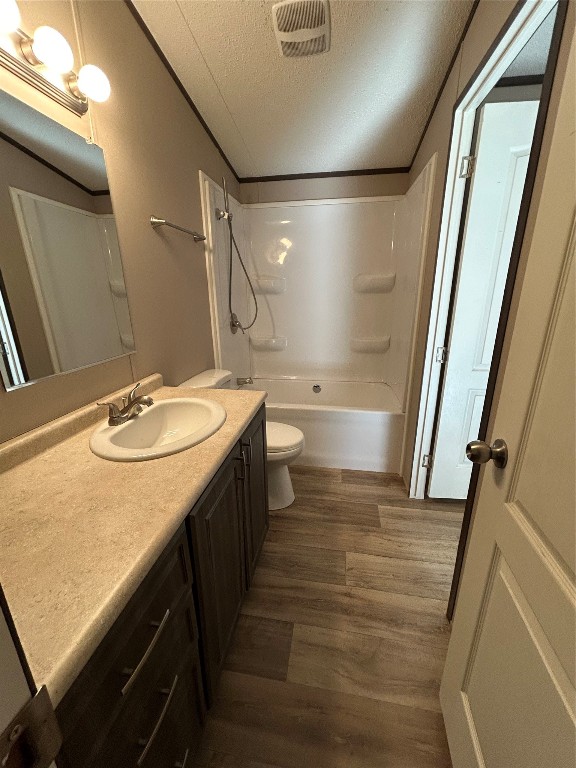 19130 Fm 1485 Road, Unit 153 New Caney, TX 77357 - Photo 5 of 9 a bathroom with a sink a toilet a mirror and shower