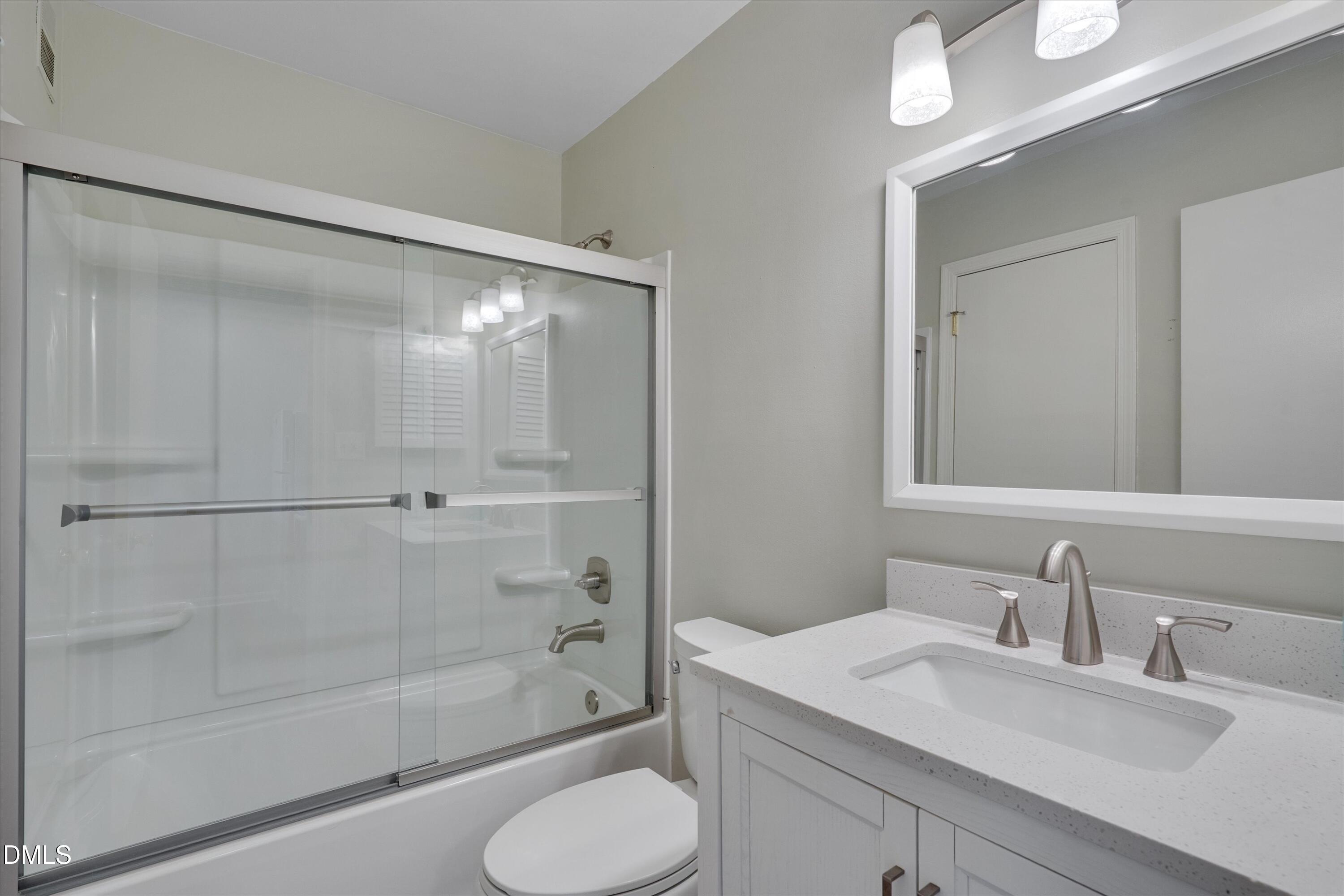 807 West Trinity Avenue, Unit 130 Durham, NC 27701 - Photo 21 of 44 a bathroom with a sink toilet and shower